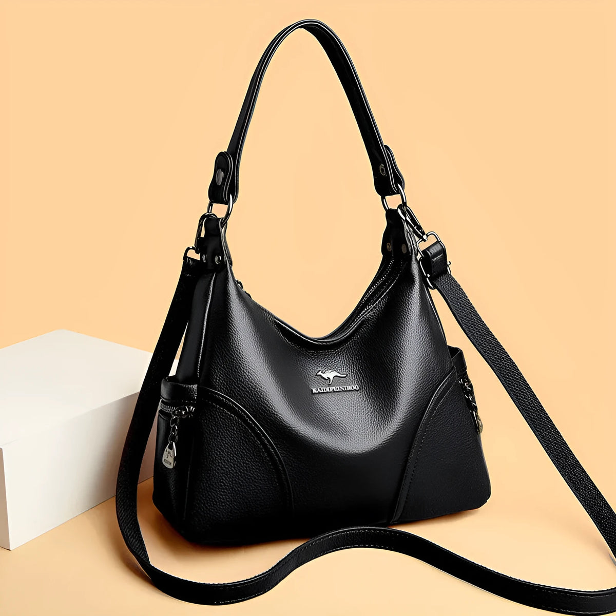 Women's soft PU shoulder bag in black, horizontal square shape with single strap and lined interior.
