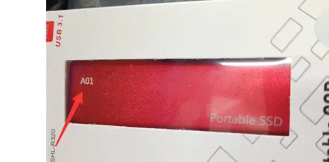 Red portable metal SSD hard drive with ultra-thin design on a grey background.