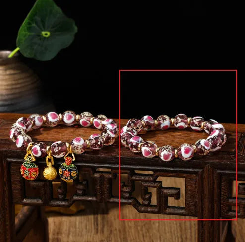Handmade heart-shaped glass bracelet with swallowing gold beast pattern in ancient fluorescent glaze