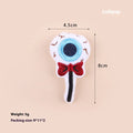 Small plush cat teaser wand with colourful eyes, candy and skull shaped attachments