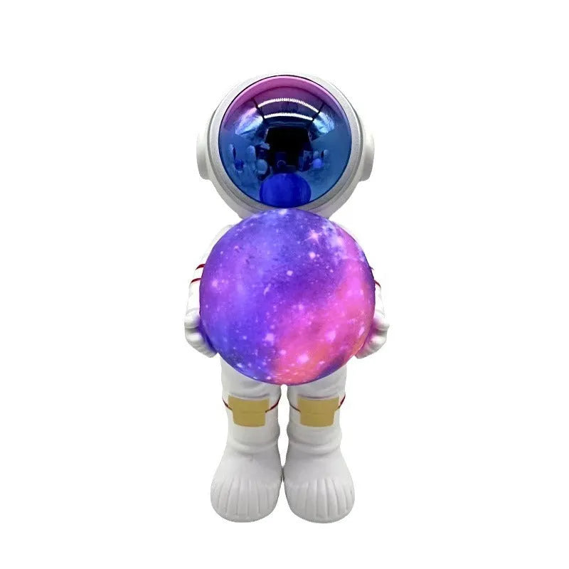 Spaceman starry sky projection lamp showing six-colour LED lighting on dark surface