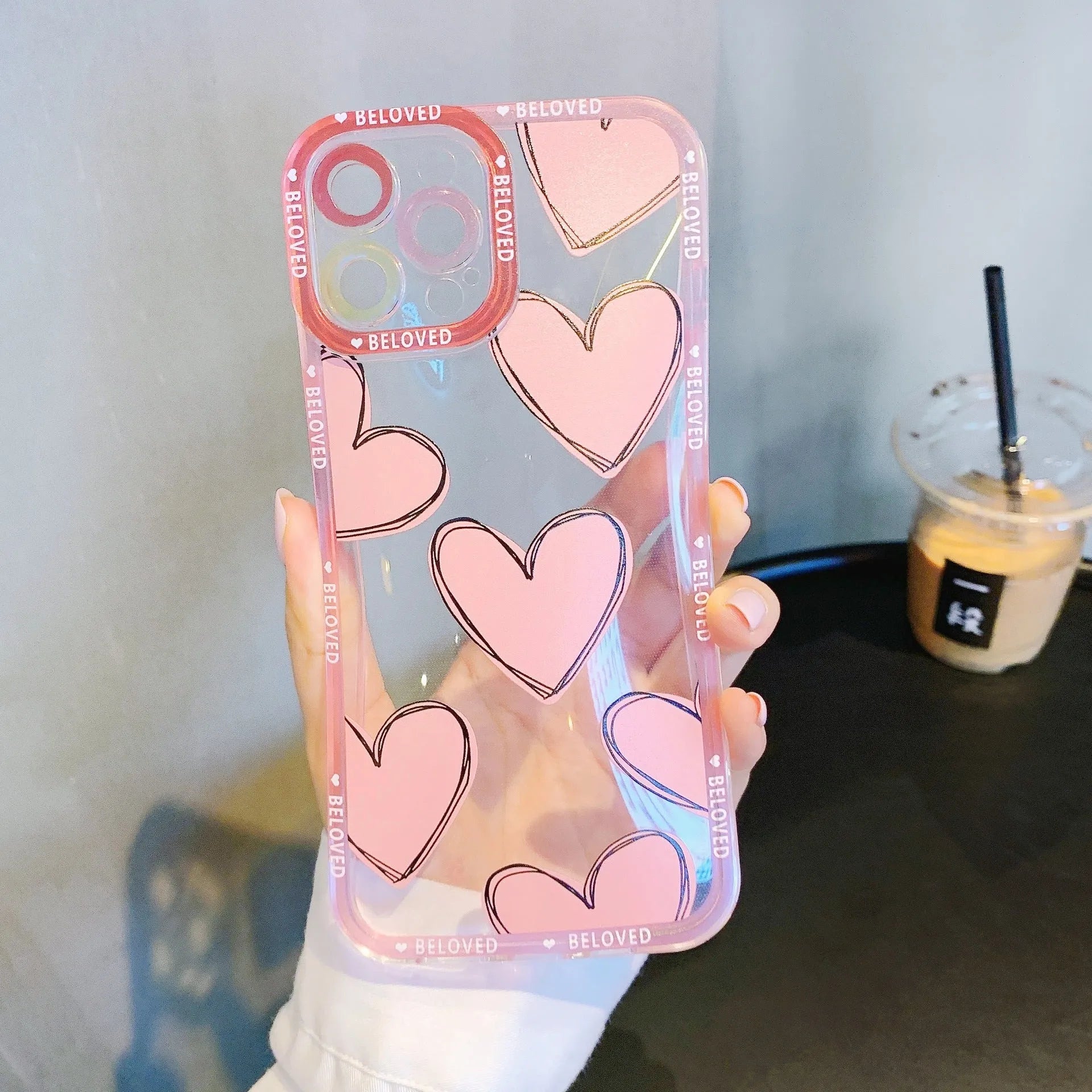 Pink mobile phone case with love heart and angel eyes design for iPhone.