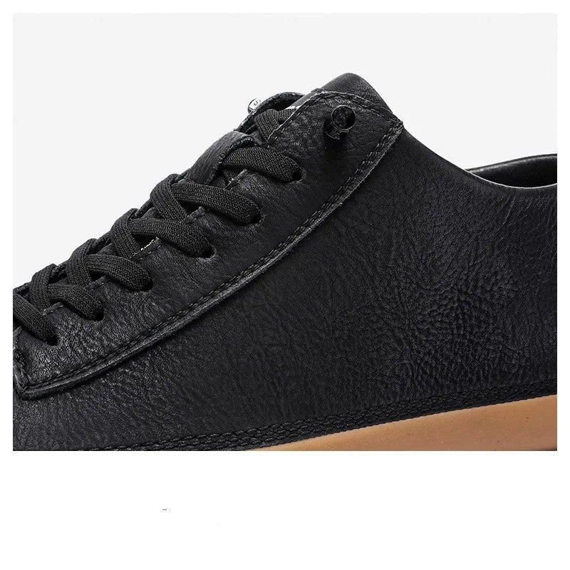 Men's black casual leather shoes with a round toe, lace-up front, and flat rubber sole.