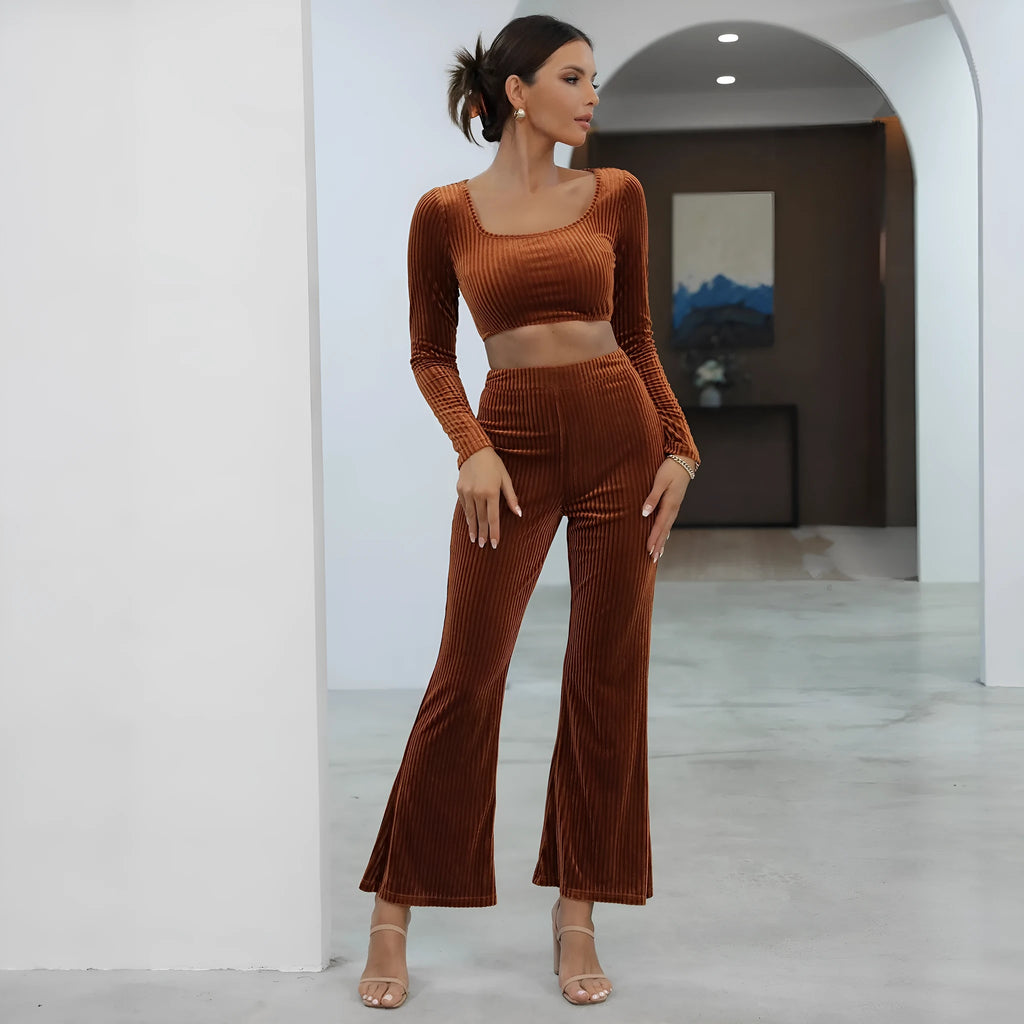 Caramel coloured long sleeve sweater and matching trousers set on a hanger.