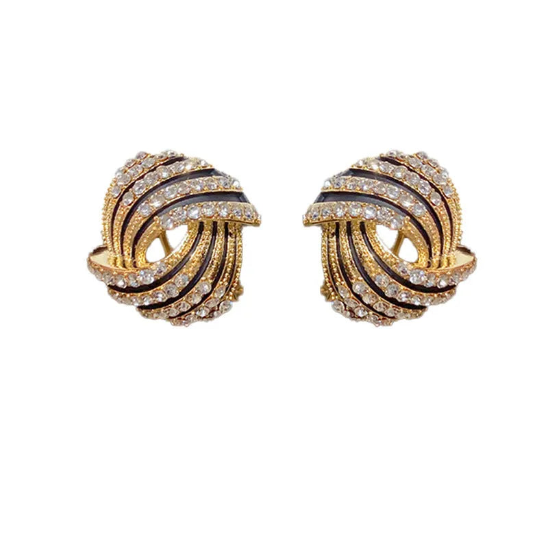 Gold plated rhinestone stud earrings with geometric ring shape and super-flash finish