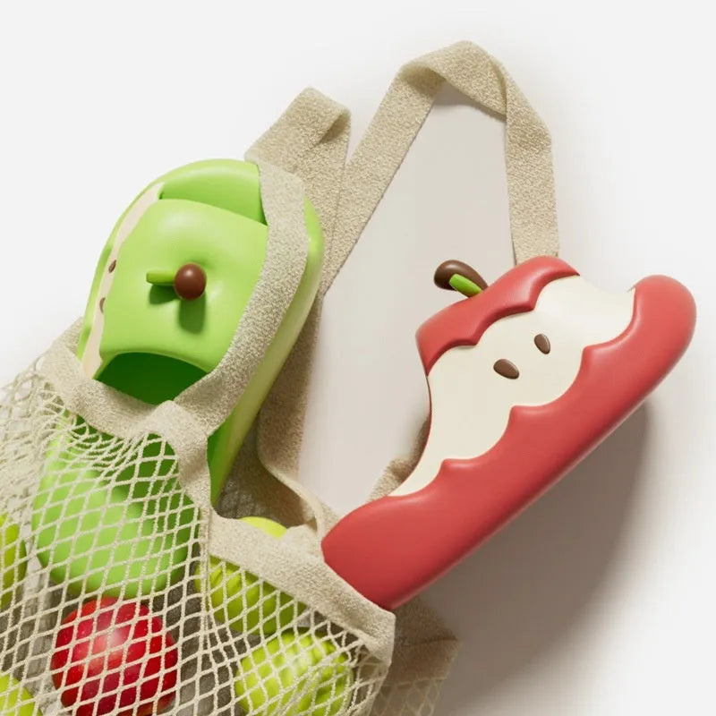 Cartoon fruit patterned EVA flip flop slippers for couples and families on a white background.