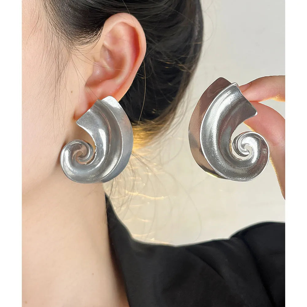 Retro geometric ear studs in gold or silver finish measuring 5cm with alloy construction