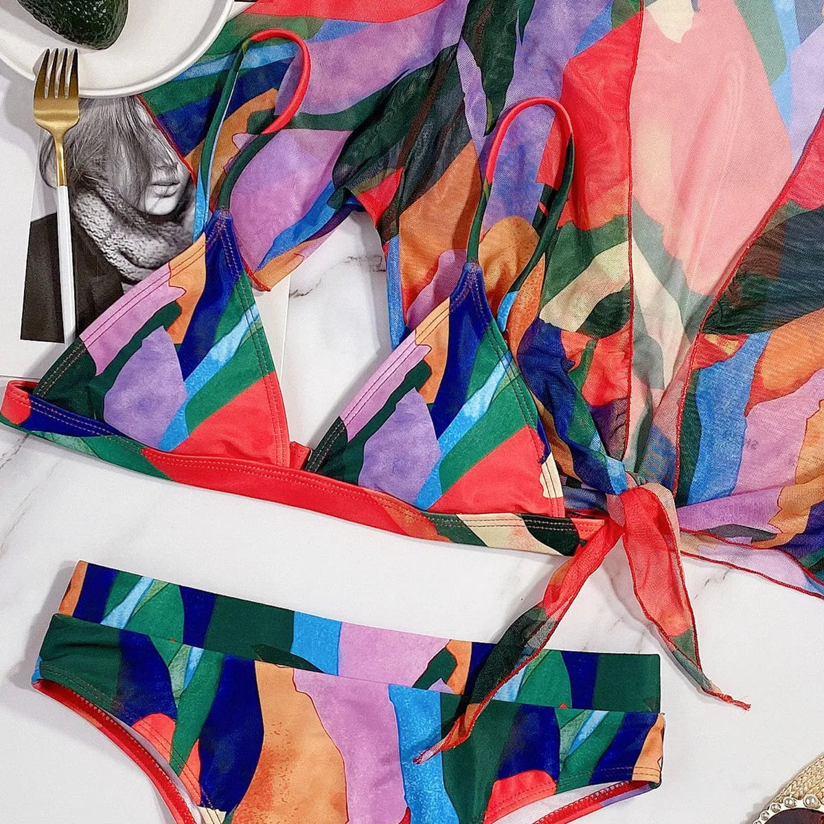 Red women's split-style swimsuit with a printed pattern, for swimming and surfing.