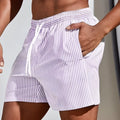 Men's grey mesh sports shorts with loose fit and elastic waistband for summer athletic wear