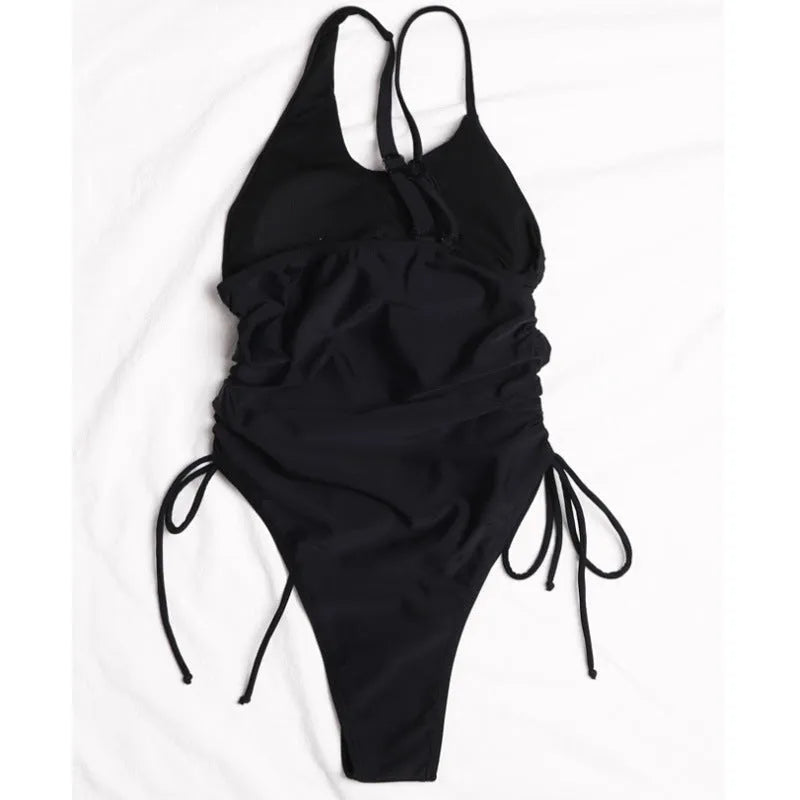 Black women's dress with sloping shoulder lacing detailing, sleeveless tight fit design