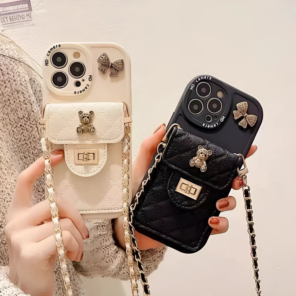 Silicone all-inclusive phone case with metal bow bear rhombus design, card holder, and black lanyard for Apple iPhone models