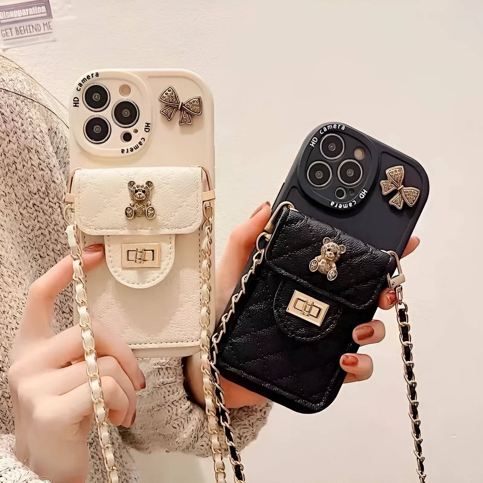 Silicone all-inclusive phone case with metal bow bear rhombus design, card holder, and black lanyard for Apple iPhone models