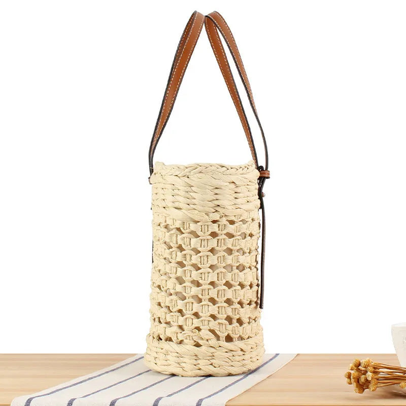 Beige paper string woven large capacity shoulder bag showing horizontal square shape and adjustable strap.