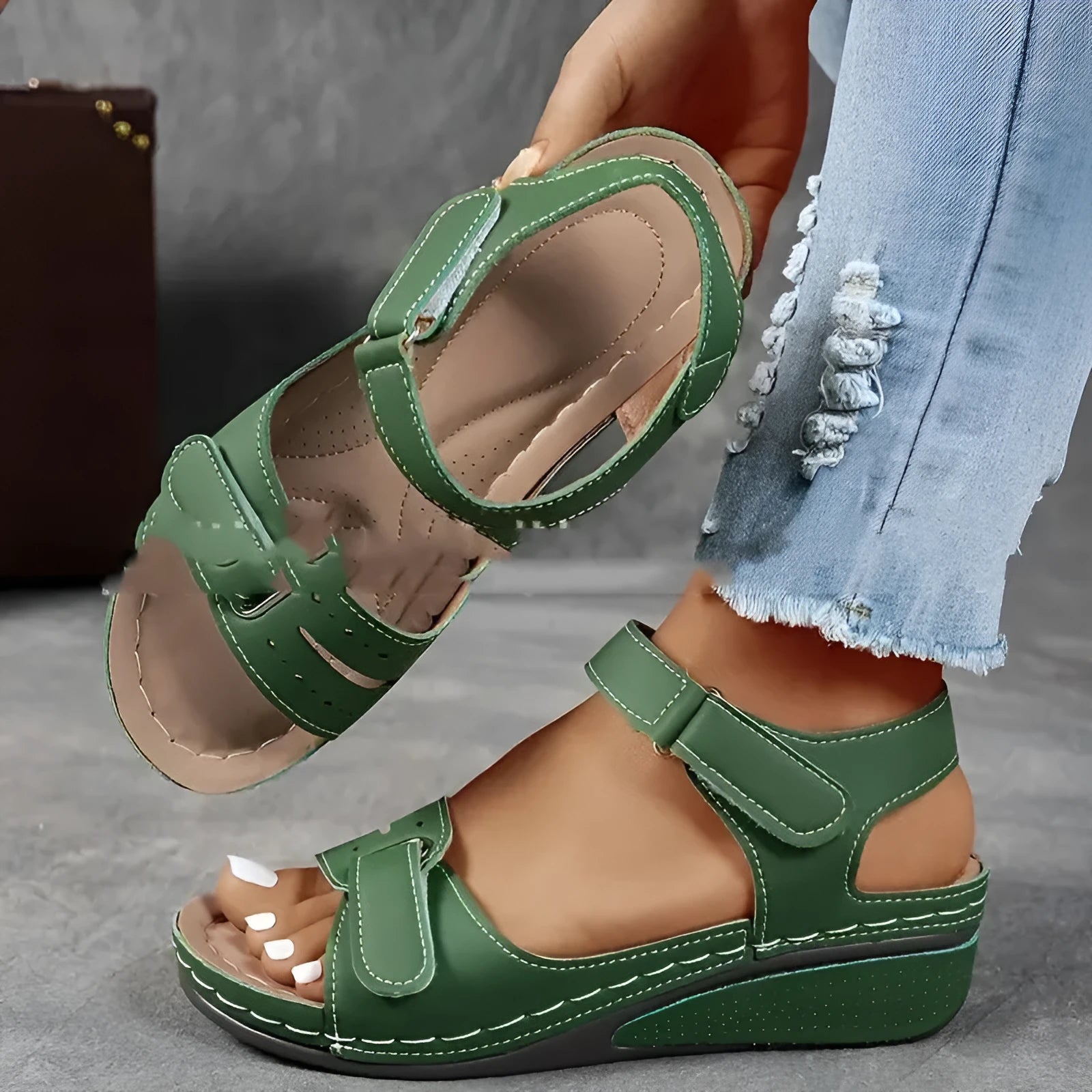 Women's beige strap sandals with thick composite sole and adjustable Velcro fastener on a white background.