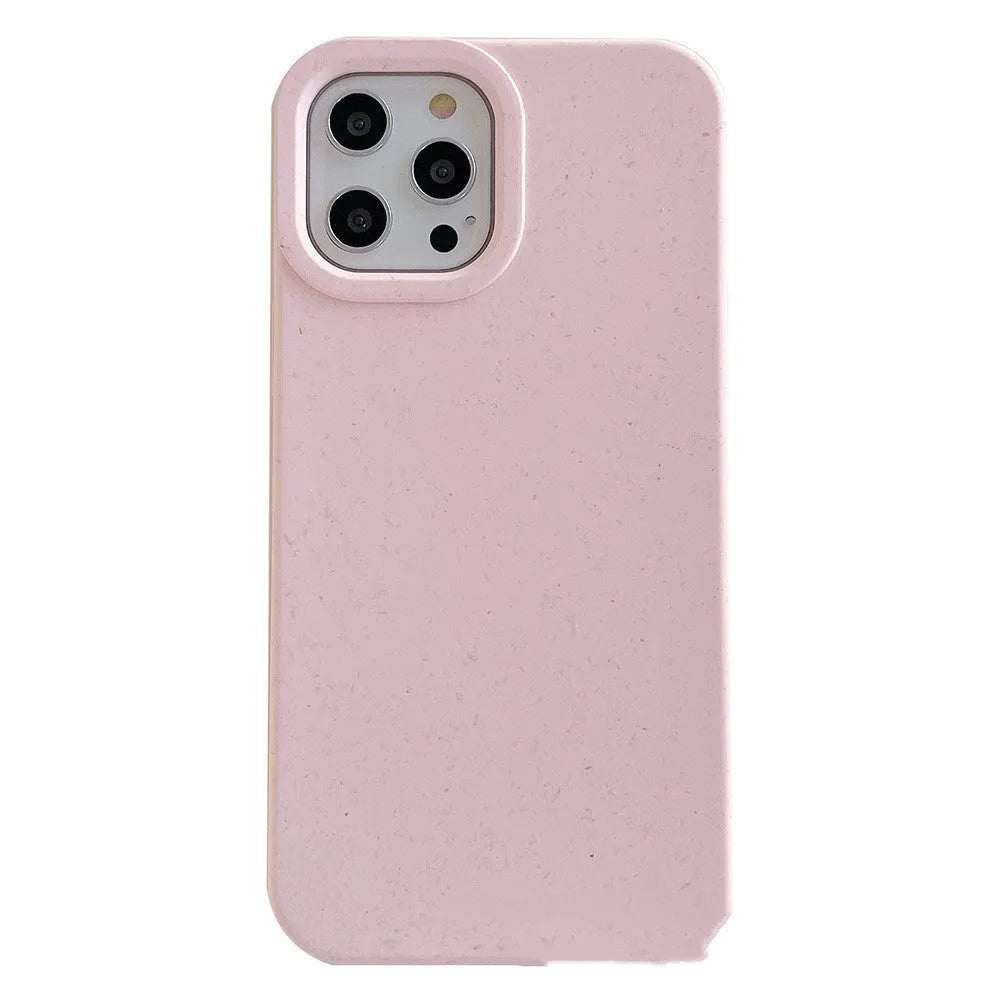 A degradable wheat straw phone case for iPhone on a wooden surface, showing its rear cover design.