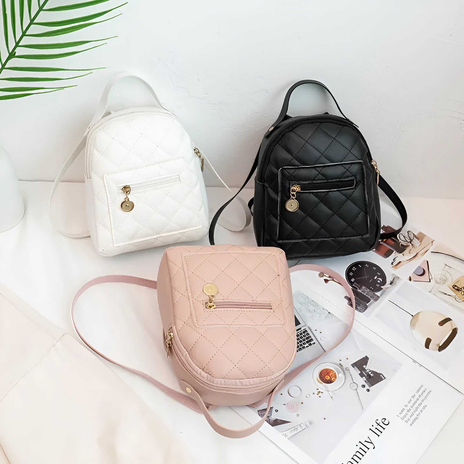 A white hard-shell girls backpack with embroidery, showing its square shape and soft top handle.
