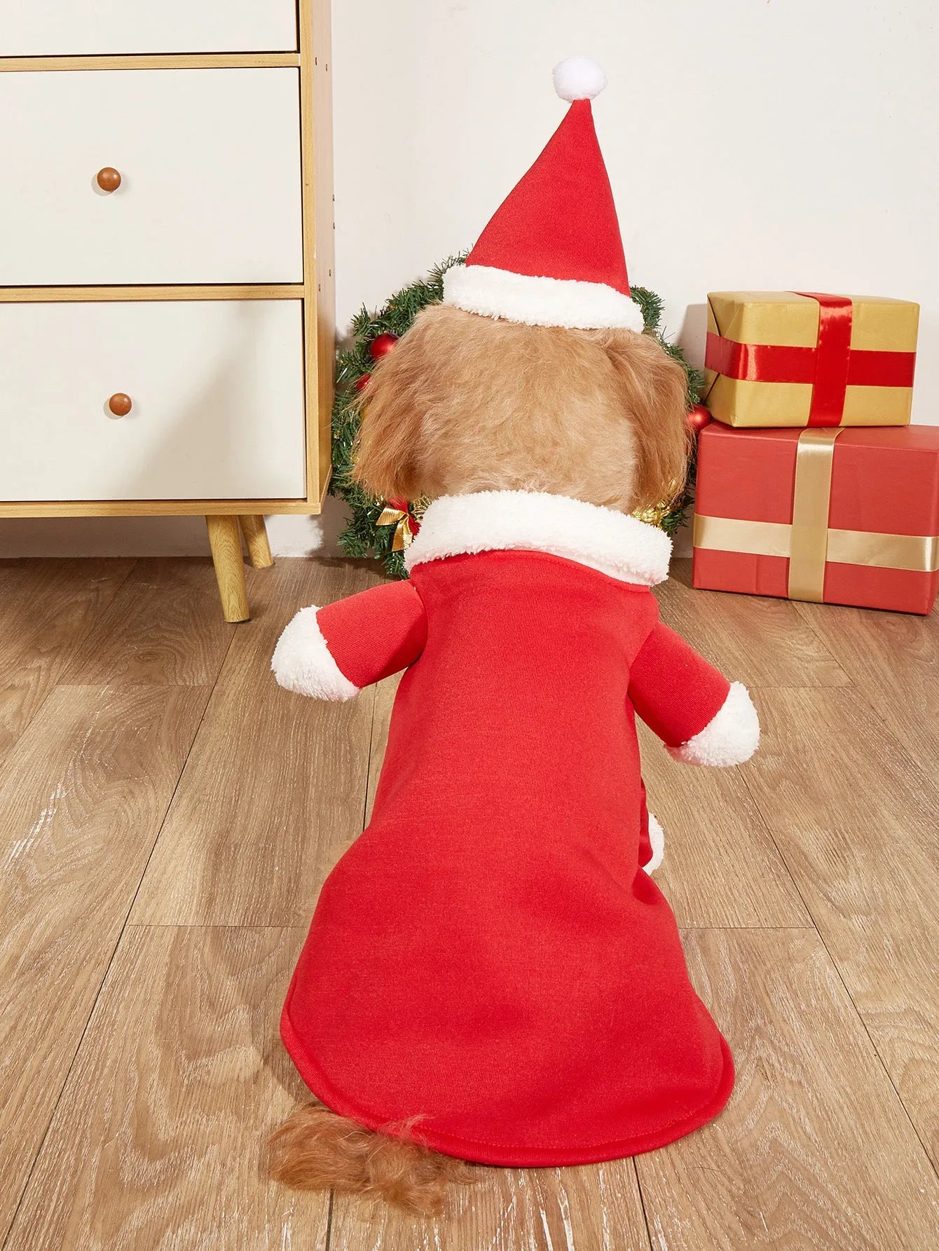 Red polyester Christmas pet costume on a small dog with matching cap
