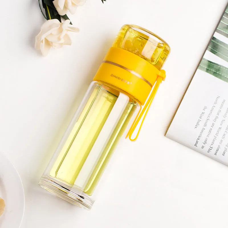 Glass water bottle with tea infuser filter showing double wall construction and portable rope