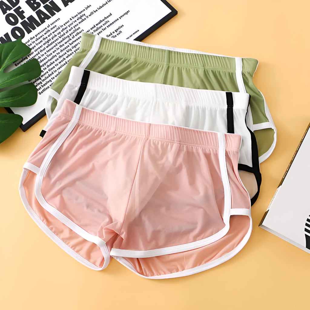 Men's low waist boxer shorts in ice silk fabric, shown in various colours including black, army green, and light purple