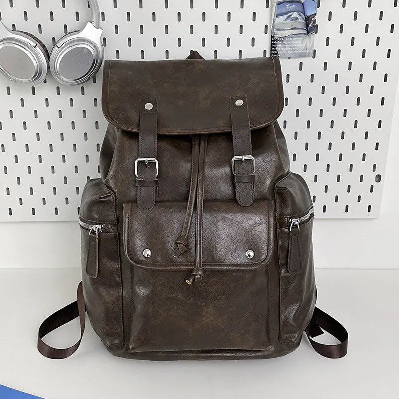 Solid colour PU couple travel backpack in black, curved shoulder strap, waterproof design for leisure travel