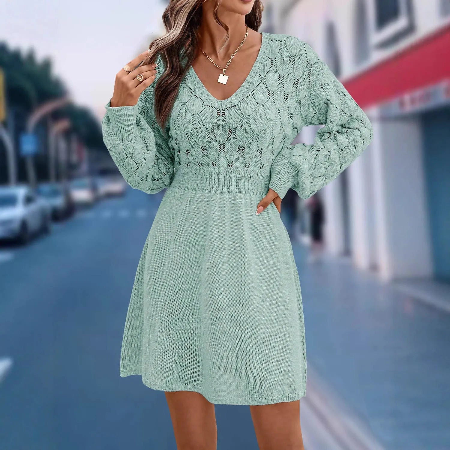 Women's apricot v-neck long sleeve dress with a high waist and a textured 3D artistic pattern.