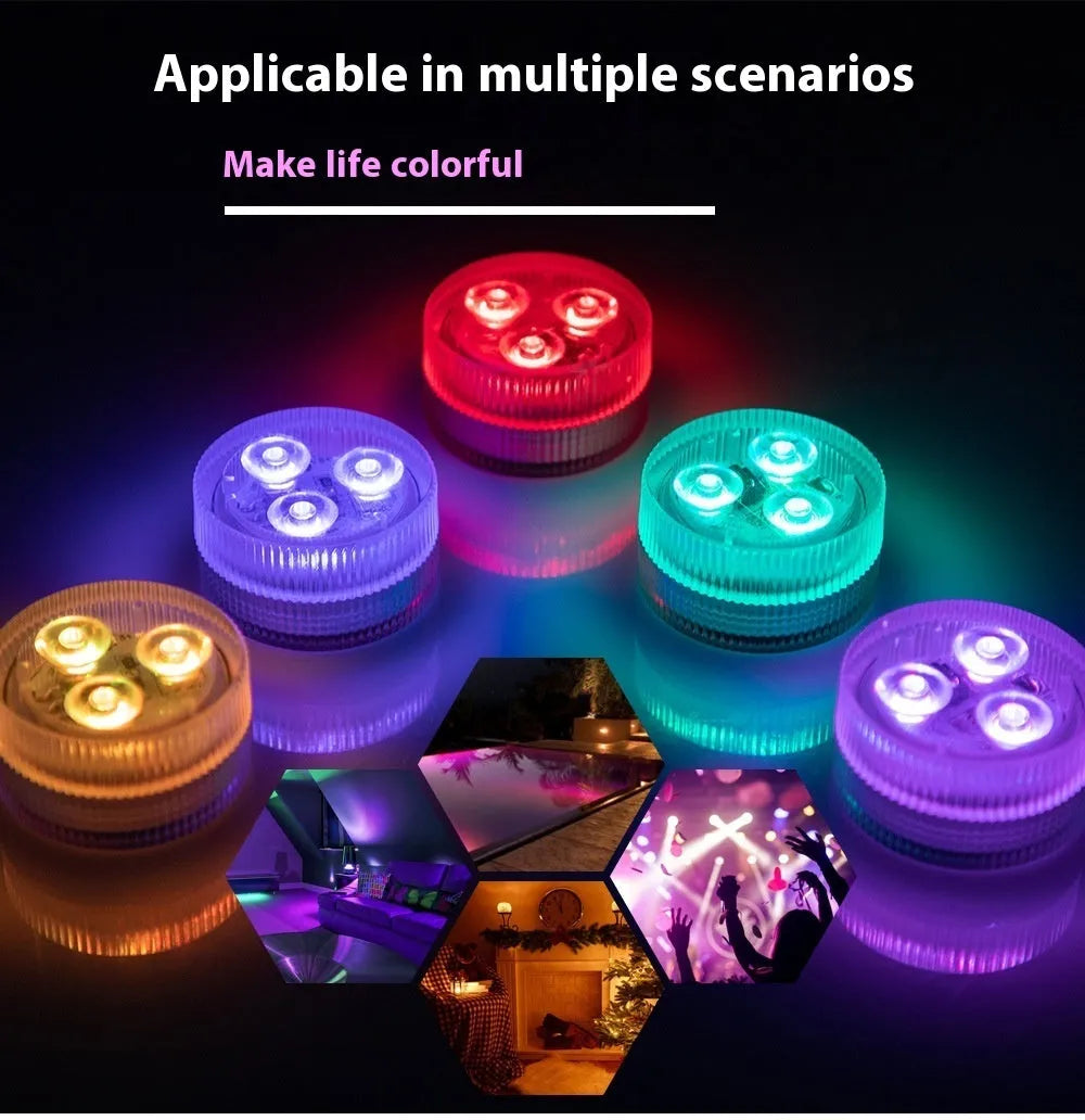 Small round submersible LED aquarium light with remote control on a white background