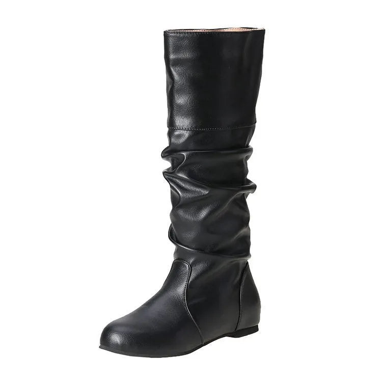 Women's flat black slip-on ankle boots with a round toe and high-top design on a neutral background.