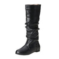 Women's flat black slip-on ankle boots with a round toe and high-top design on a neutral background.