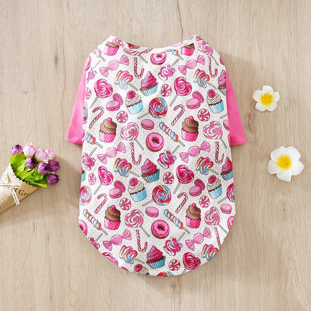 Colourful printed polyester t-shirt on a small dog, showing the casual fit and design.