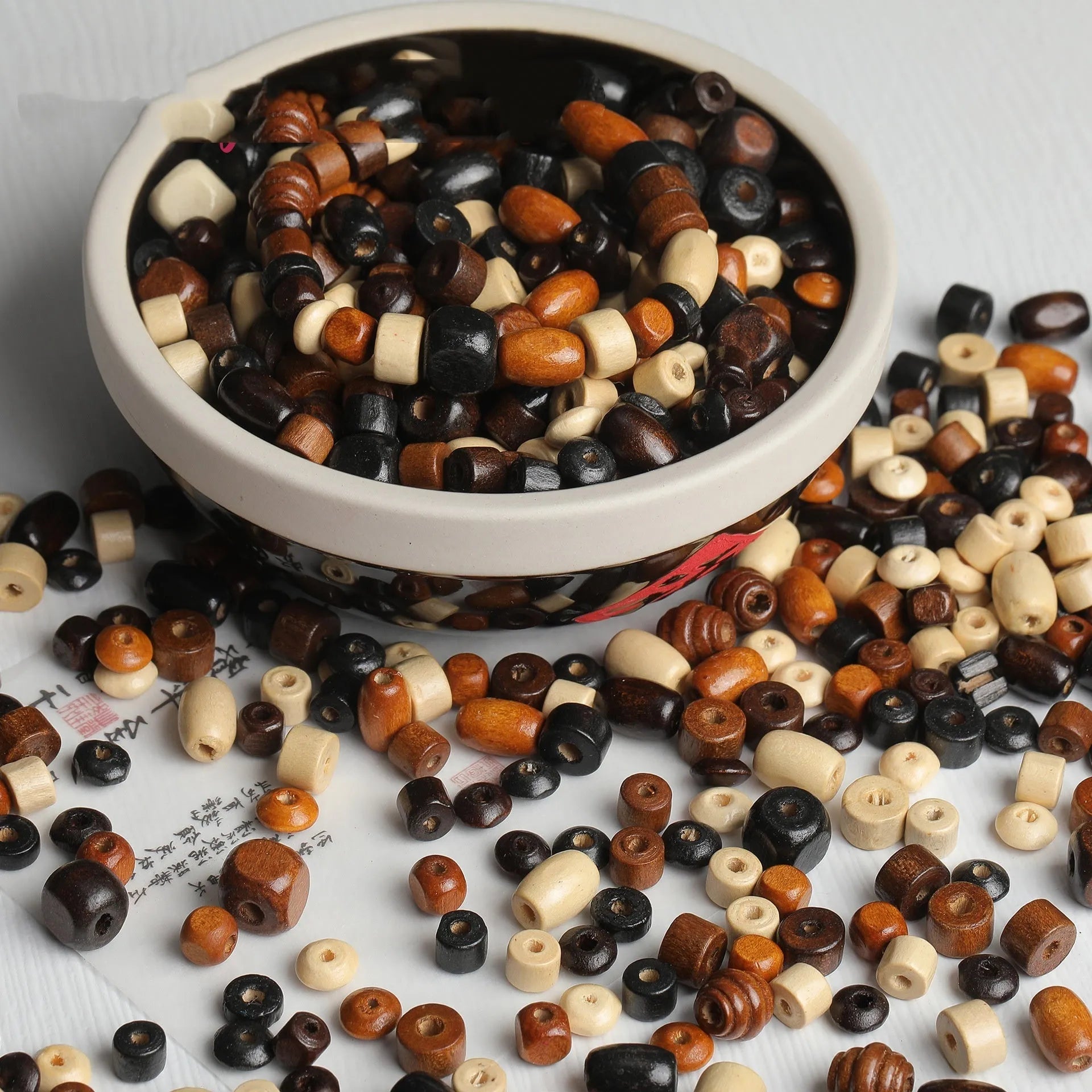 Mixed colour vintage solid wood beads in a 10g pack for DIY jewellery making.