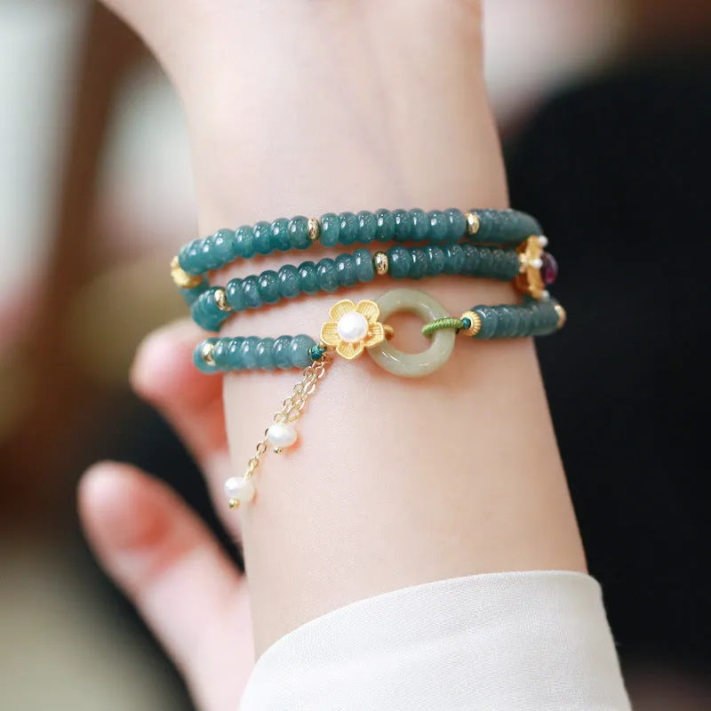 Women's blue water jade abacus beads bracelet with three tourmaline rings and pearl accents