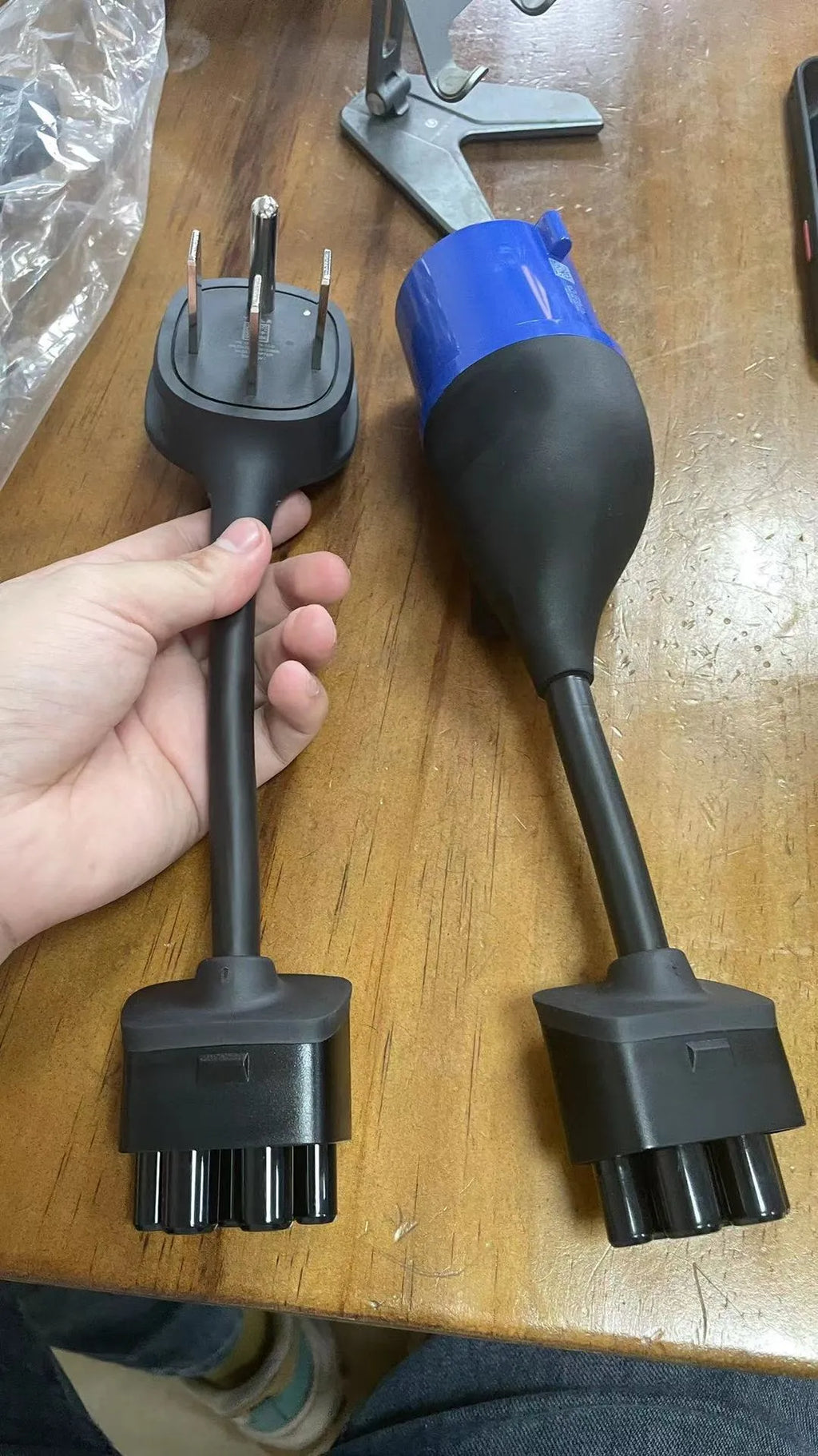 American plug to car charger adapter cable with white sheath on a grey background.