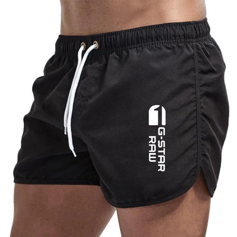Man wearing thin polyester sports shorts with an elastic waistband in a bright colour like fluorescent green.