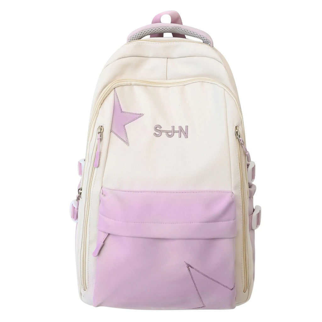 Mori style nylon backpack for women, light blue colour, shown with pendant on a plain background