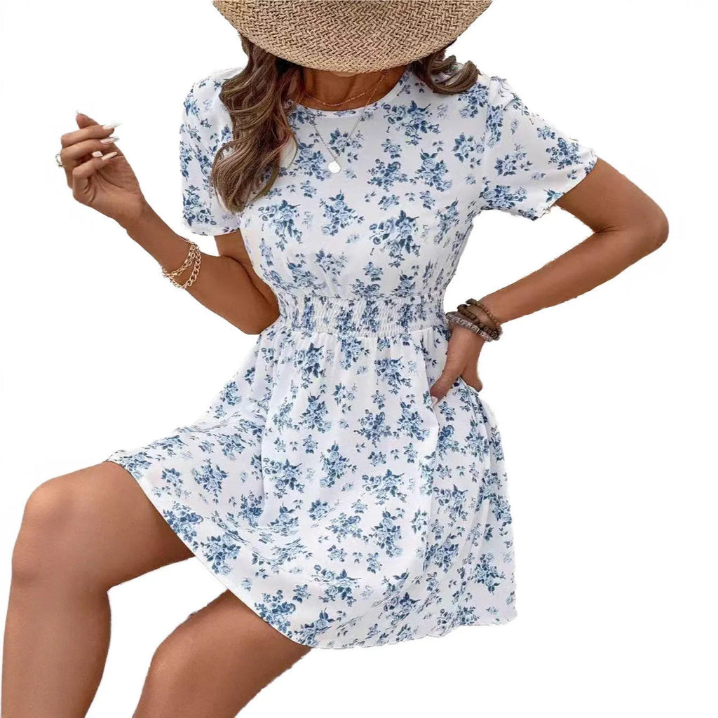 Light blue women's A-line dress with a high waist and regular sleeves on a mannequin.