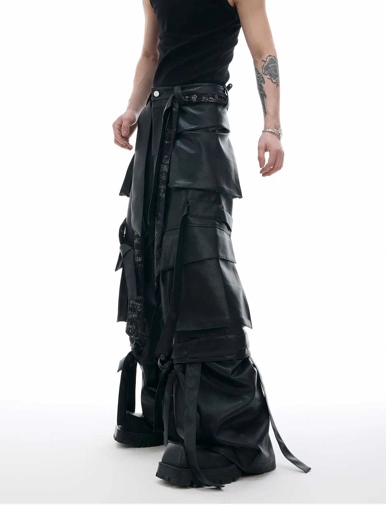 Black loose-fit men's cargo trousers with quilted panels, ribbon trim, and multiple pockets.