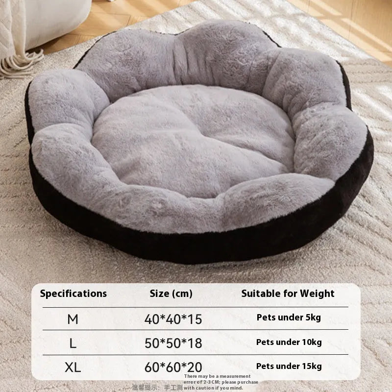 Round grey and black plush cat bed with a raised rim and a removable inner nest, shown on a wooden floor.