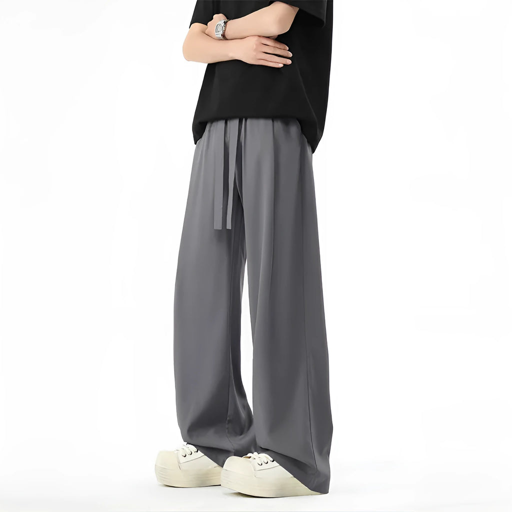 Men's quick-drying loose straight wide-leg casual pants in black polyester blend, side view