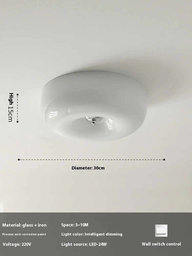 American style cream coloured bedroom ceiling lamp with three-colour light fitting on a white ceiling.
