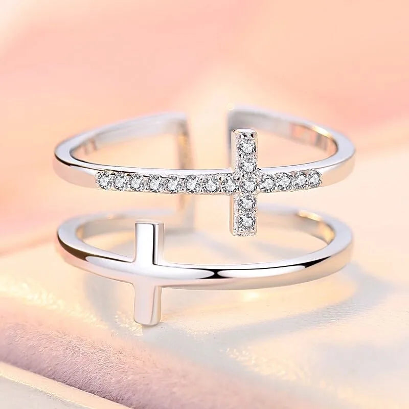 Geometric adjustable copper ring with a white gold finish and a central zircon stone in a sterling silver setting.