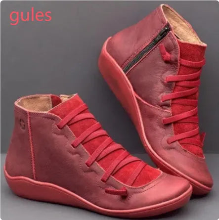Women's casual flat ankle boots in artificial PU leather with a round toe and wedge rubber sole.
