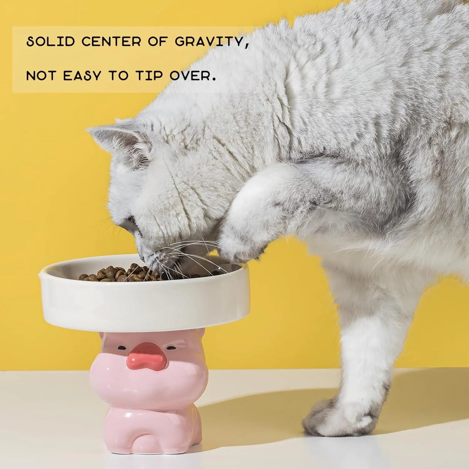 Raised ceramic cat bowl in animal theme design showing height and wide feeding surface