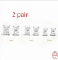 S925 sterling silver stud earrings with a geometric petal and crystal flower design in gold or platinum finish.