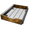 Black modern storage rack with pull-out basket drawer, made from wood and iron, for home organisation.