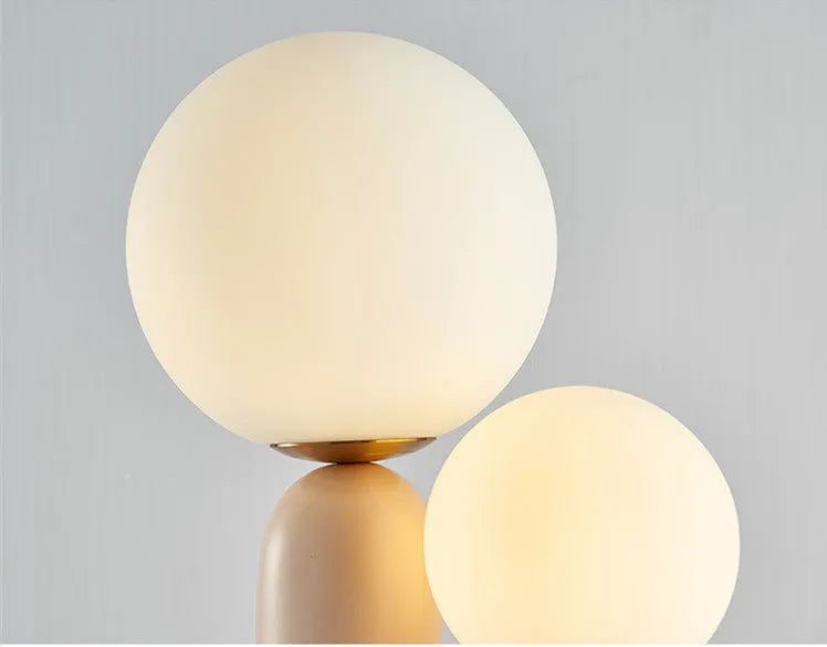 Double-head resin table lamp with pink baking paint finish, glass shade, 49cm height, on bedside table