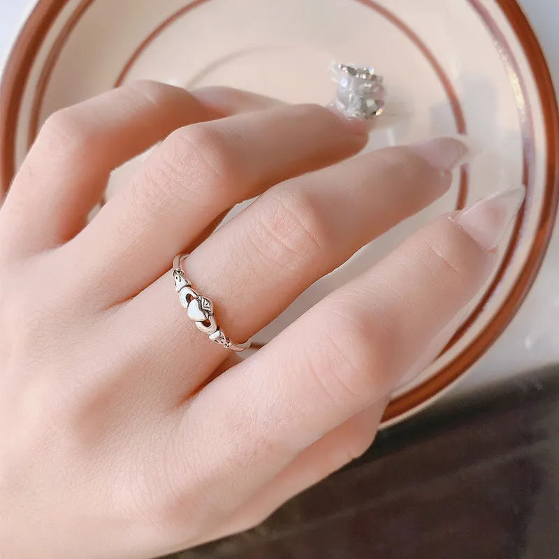 Women's copper heart open ring with retro silver finish showing adjustable back design