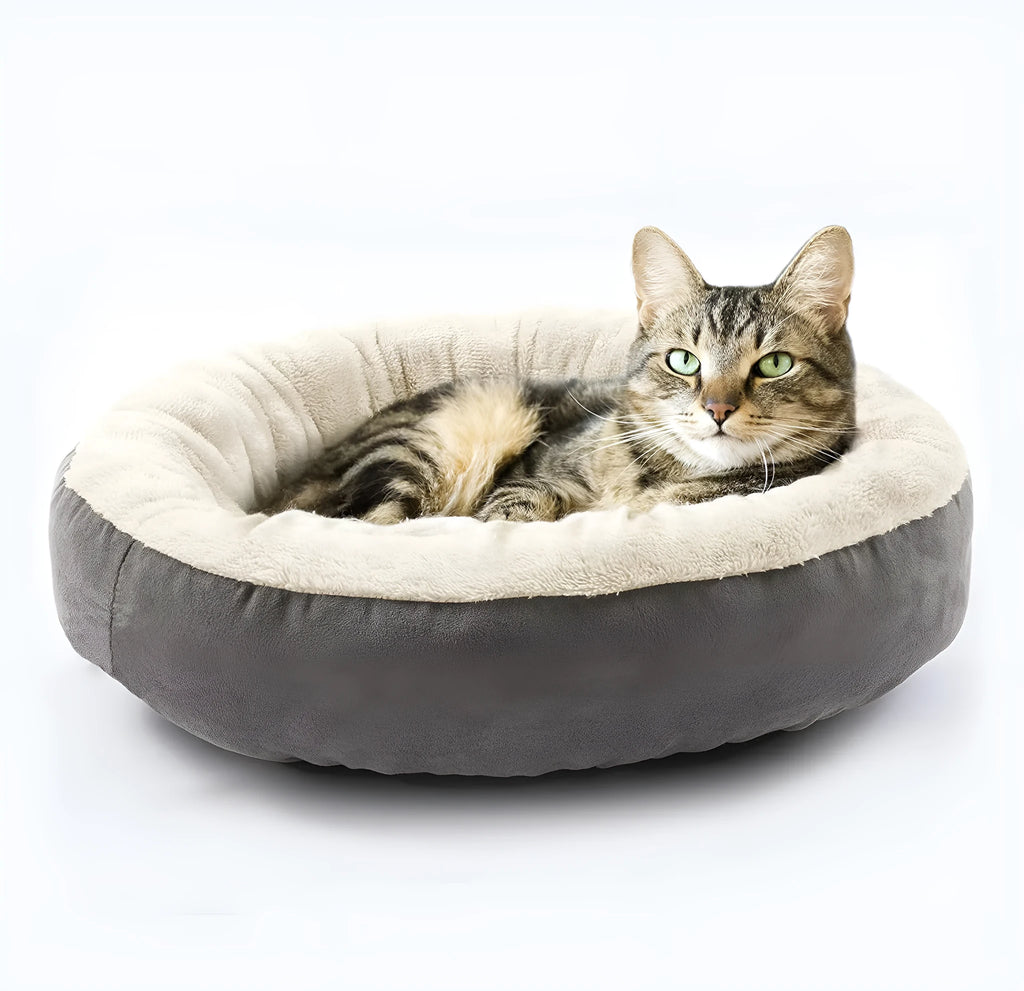 Circular grey cloth pet bed with raised sides for a cat or small dog
