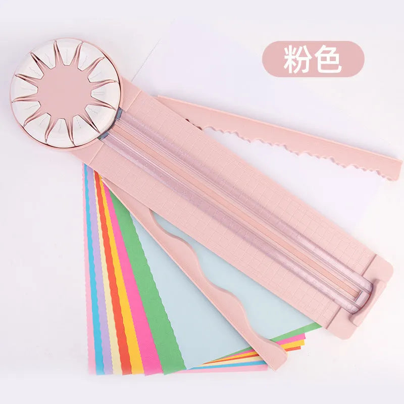 Pink plastic multifunctional 12-in-1 paper cutter and scoring board with size guides.