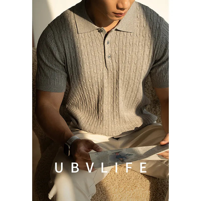 Men's short sleeve business top in khaki colour, shown on a hanger.