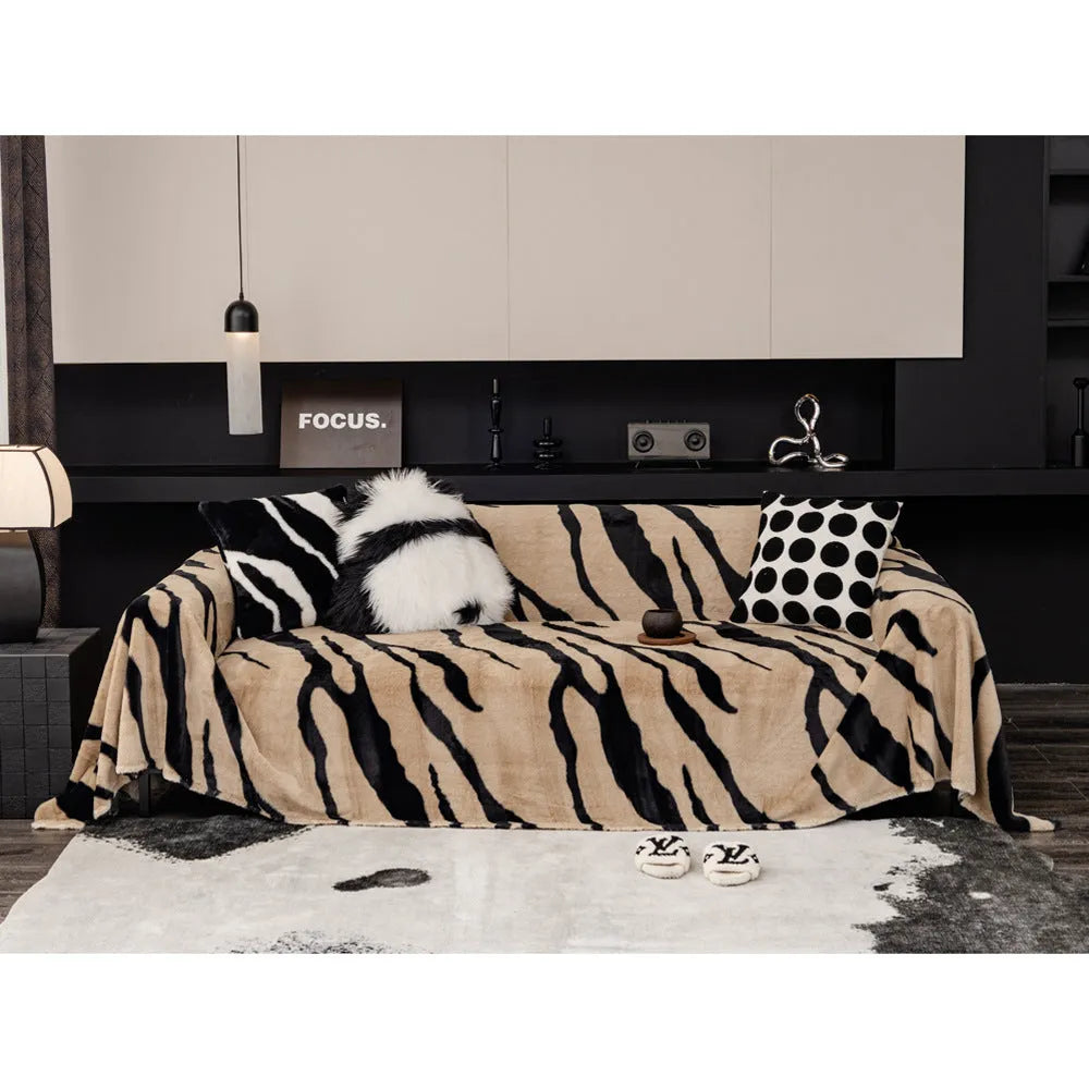 Zebra pattern flannel sofa cover with matching pillowcase on a sofa.